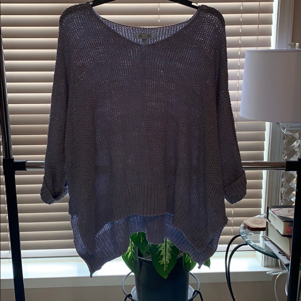 women’s blue knitted sweater
